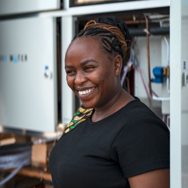 2023 Rolex Awards for Enterprise Laureate Beth Koigi
                                        in front of Majik Water’s Atmospheric Water Generator
                                        during the installation process in Kakuma refugee
                                        camp.